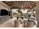 Relaxing outdoor patio with seating area and fire pit, overlooking scenic views at 8124 E Paraiso Dr, Scottsdale, AZ 85255