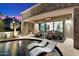 Expansive backyard oasis with a luxurious pool and comfortable lounge seating at 8124 E Paraiso Dr, Scottsdale, AZ 85255