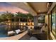 Relaxing pool area with lounge chairs and seating; evening view at 8124 E Paraiso Dr, Scottsdale, AZ 85255