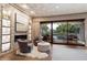 Relaxing sitting area with fireplace and sliding doors to pool at 8124 E Paraiso Dr, Scottsdale, AZ 85255
