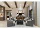 Cozy sitting area with plush seating and a large statement mirror at 8124 E Paraiso Dr, Scottsdale, AZ 85255