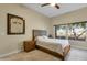 Relaxing bedroom with comfortable bed, ceiling fan and a large window for lots of natural light at 8245 E Bell Rd # 142, Scottsdale, AZ 85260