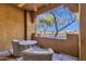 Cozy outdoor patio with a table, chairs, and a nice view at 8245 E Bell Rd # 142, Scottsdale, AZ 85260