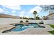 Inviting kidney-shaped pool with spacious patio and landscaping at 8638 E Dahlia Dr, Scottsdale, AZ 85260