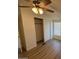 Bedroom with wood-look flooring, ceiling fan, and large closet at 8832 E Pueblo Ave # 29, Mesa, AZ 85208