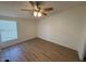 Simple bedroom with wood-look flooring and a window with blinds at 8832 E Pueblo Ave # 29, Mesa, AZ 85208