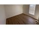 Simple bedroom with wood-look flooring and a window with blinds at 8832 E Pueblo Ave # 29, Mesa, AZ 85208