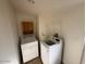 Laundry room with washer, dryer, and overhead storage at 8832 E Pueblo Ave # 29, Mesa, AZ 85208