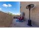 Spacious patio with comfortable seating and a heater at 9820 N Central Ave # 112, Phoenix, AZ 85020