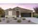 Single-story home with a terracotta tile roof and a two-car garage at 10206 S Bickwell Trl, Apache Junction, AZ 85120