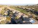 Expansive aerial view of a luxury neighborhood adjacent to a pristine green golf course at 10260 E White Feather Ln # 1038, Scottsdale, AZ 85262