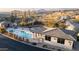 Elevated view of a community pool area, including a gym and desert landscaping at 10260 E White Feather Ln # 1038, Scottsdale, AZ 85262