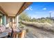 Relaxing covered patio with comfortable striped seating overlooking the arid desert landscape at 10260 E White Feather Ln # 1038, Scottsdale, AZ 85262