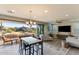 Inviting living room with dining area, contemporary furnishings, a ceiling fan, and sliding doors to the patio at 10260 E White Feather Ln # 1038, Scottsdale, AZ 85262