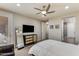 Calm and spacious main bedroom with a ceiling fan, neutral walls, and en suite bathroom at 10260 E White Feather Ln # 1038, Scottsdale, AZ 85262