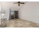 Spacious bedroom with tile floors and sliding door access to balcony at 10610 S 48Th St # 2096, Phoenix, AZ 85044