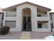 Building exterior with arched entryway and stairs at 10610 S 48Th St # 2096, Phoenix, AZ 85044