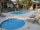 Community pool and spa with lounge chairs at 10610 S 48Th St # 2096, Phoenix, AZ 85044