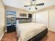 Main bedroom with a king-size bed and wood nightstands at 11422 W Pinehollow Dr, Surprise, AZ 85378