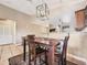 Dining area with a wood table and chairs, near kitchen at 11422 W Pinehollow Dr, Surprise, AZ 85378