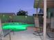 Night view of the pool area with patio furniture at 11422 W Pinehollow Dr, Surprise, AZ 85378