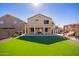 Large backyard with artificial turf and home view at 11830 W Avenida Del Sol --, Sun City, AZ 85373