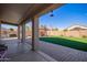 Covered patio overlooking a grassy backyard with artificial turf at 11830 W Avenida Del Sol --, Sun City, AZ 85373