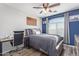 Spacious bedroom with a queen-size bed and a built-in desk at 11830 W Avenida Del Sol --, Sun City, AZ 85373