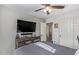 Bedroom with a large TV, dresser, and plenty of closet space at 11830 W Avenida Del Sol --, Sun City, AZ 85373