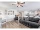 Living room with gray sectional sofa and farmhouse style decor at 11830 W Avenida Del Sol --, Sun City, AZ 85373