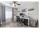 Home office with a desk, two monitors, and ample natural light at 11830 W Avenida Del Sol --, Sun City, AZ 85373