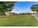 Community park with green grass and walking paths at 11830 W Avenida Del Sol --, Sun City, AZ 85373