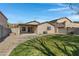 Spacious backyard with grassy area and patio at 1195 E Dust Devil Dr, San Tan Valley, AZ 85143