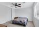 Well-lit bedroom with a ceiling fan and double closet at 1195 E Dust Devil Dr, San Tan Valley, AZ 85143