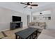 Open living room with a stylish media console and neutral decor at 1195 E Dust Devil Dr, San Tan Valley, AZ 85143