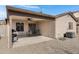 Covered patio with grill and access to backyard at 1195 E Dust Devil Dr, San Tan Valley, AZ 85143