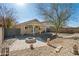 House backyard view with fire pit and trees at 12000 W Bloomfield Rd, El Mirage, AZ 85335