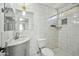 Bathroom with white tile, marble vanity, and a shower/tub combo at 12000 W Bloomfield Rd, El Mirage, AZ 85335