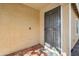 Front entry with a security door and terracotta tile flooring at 12000 W Bloomfield Rd, El Mirage, AZ 85335