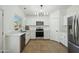 Updated kitchen featuring stainless steel appliances and white cabinetry at 12000 W Bloomfield Rd, El Mirage, AZ 85335