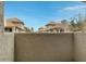 Private balcony overlooking the community with a view of the buildings and some trees at 1211 N Miller Rd # 201, Scottsdale, AZ 85257