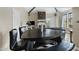 Unique triangular dining table with black leather chairs at 1211 N Miller Rd # 201, Scottsdale, AZ 85257