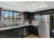 Modern kitchen with stainless steel appliances and granite countertops at 1211 N Miller Rd # 201, Scottsdale, AZ 85257