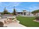 View of backyard, pool, and outdoor kitchen at 12210 N 76Th Pl, Scottsdale, AZ 85260