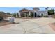 Stunning curb appeal of a large home with a long driveway at 12210 N 76Th Pl, Scottsdale, AZ 85260