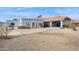 House exterior showcasing a large driveway and landscaping at 12210 N 76Th Pl, Scottsdale, AZ 85260