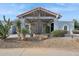 Spanish style home with a covered entryway and xeriscaped landscaping at 12210 N 76Th Pl, Scottsdale, AZ 85260