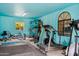 Well-equipped home gym featuring various exercise machines at 12210 N 76Th Pl, Scottsdale, AZ 85260