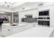 Modern kitchen with white cabinets, stainless steel appliances, and a large island at 12210 N 76Th Pl, Scottsdale, AZ 85260