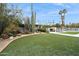 Landscaped lawn with artificial turf and desert landscaping at 12210 N 76Th Pl, Scottsdale, AZ 85260